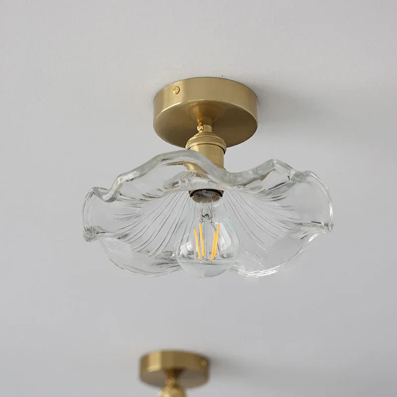 Ceiling decorative lamp with a glass leaf-shaped shade