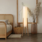 Modern floor lamp with wooden legs and a cylindrical shade