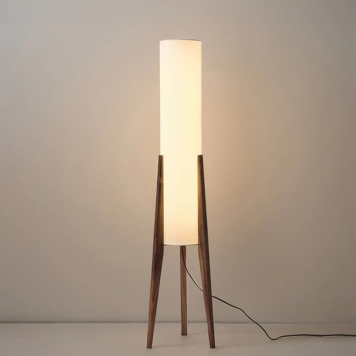 Modern floor lamp with wooden legs and a cylindrical shade